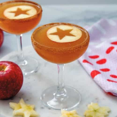 Closeup view of an apple cider martini with apple round star.
