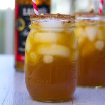 Closeup view of an apple ginger margarita in a mason jar.
