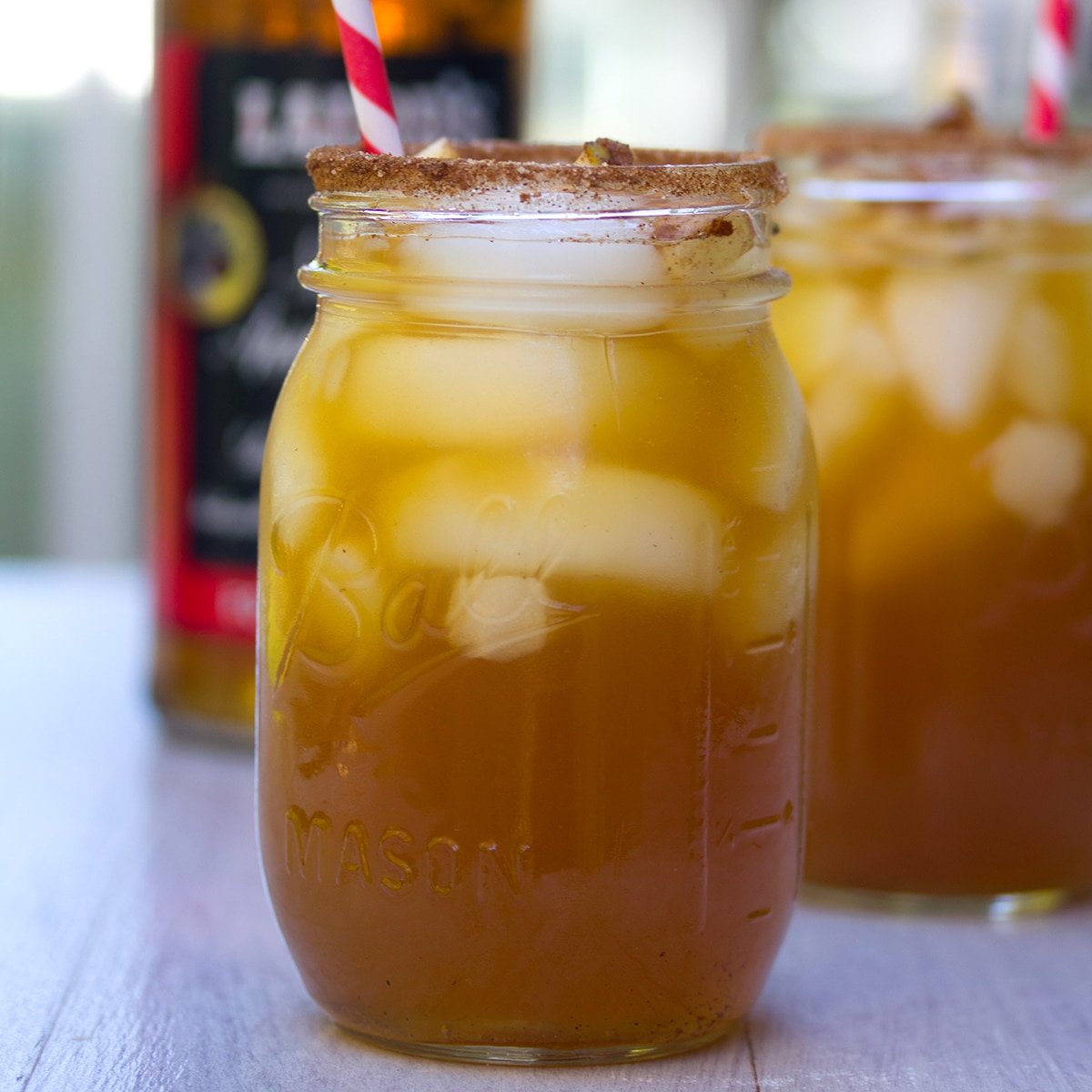 Closeup view of an apple ginger margarita in a mason jar.