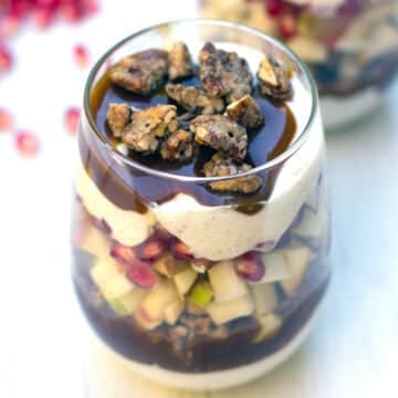 Overhead view of an apple pomegranate carmael yogurt parfait.