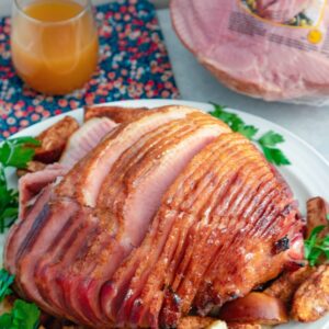 Apple Spice Glazed Ham with Baked Apples -- This Apple Spice Glazed Ham with Baked Apples is perfect for serving to your holiday crowd, but you also might not be able to resist making it for your family on a random weeknight | wearenotmartha.com