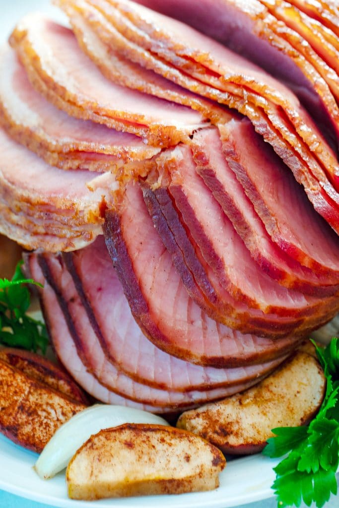 Close-up of spiral cut slices of apple spice glazed ham