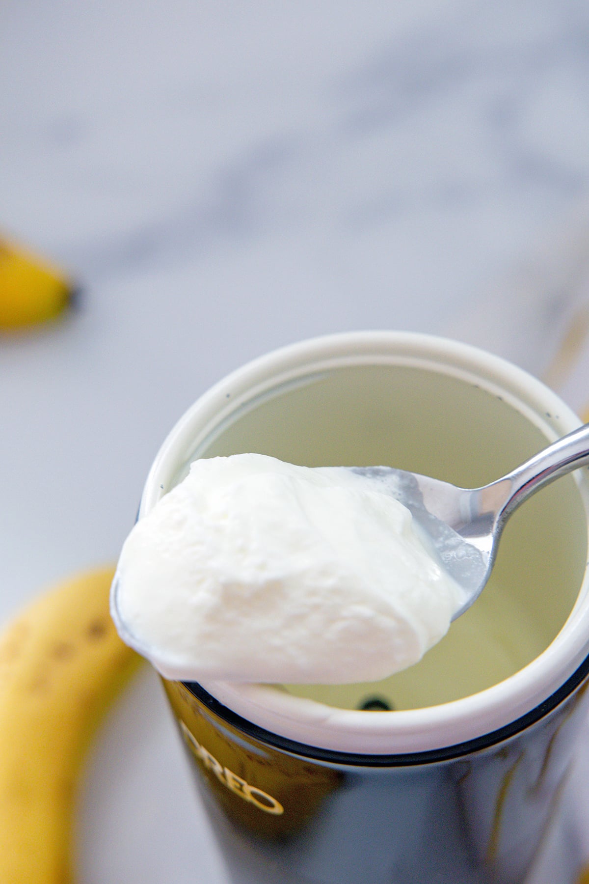 Banana bread cold foam on a spoon.