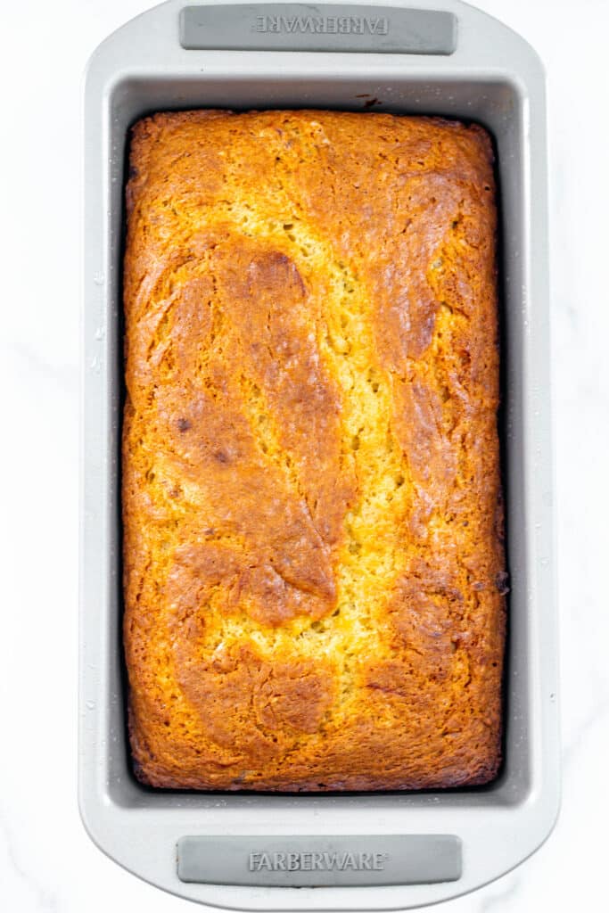 Banana bread with cake mix in loaf pan just out of the oven.