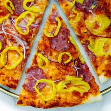 Closeup view of a slice of banana pepper pizza.