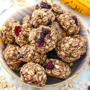 Overhead closeup view of banana maple cranberry cookies in a bowl.