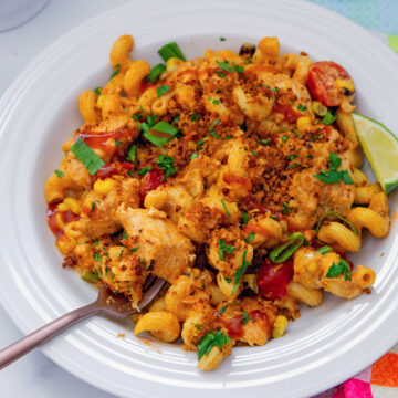 Closeup view of a plate of BBQ Chicken Pasta with fork.