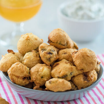 Closeup view of fried brussels sprouts in a bowl.
