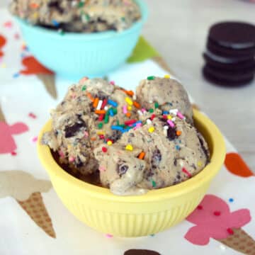 Closeup view of a bowl of coffee Oreo ice cream with lots of sprinkles.