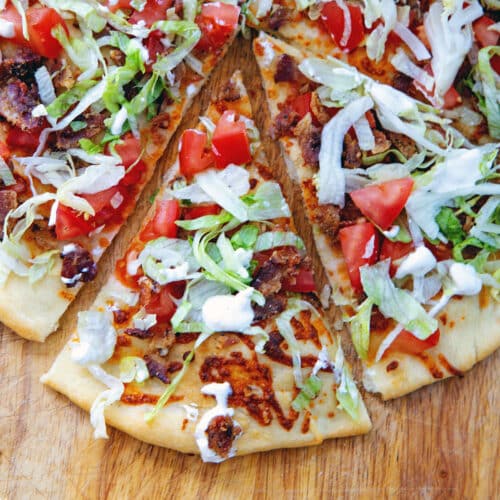 Overhead closeup view of a BLT pizza.