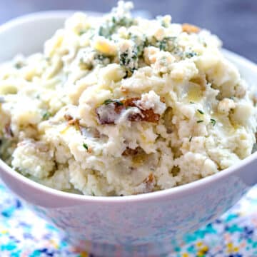 Closeup view of blue cheese mashed potatoes in white serving bowl.