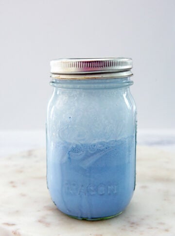 Blue coconut cold foam in a mason jar.