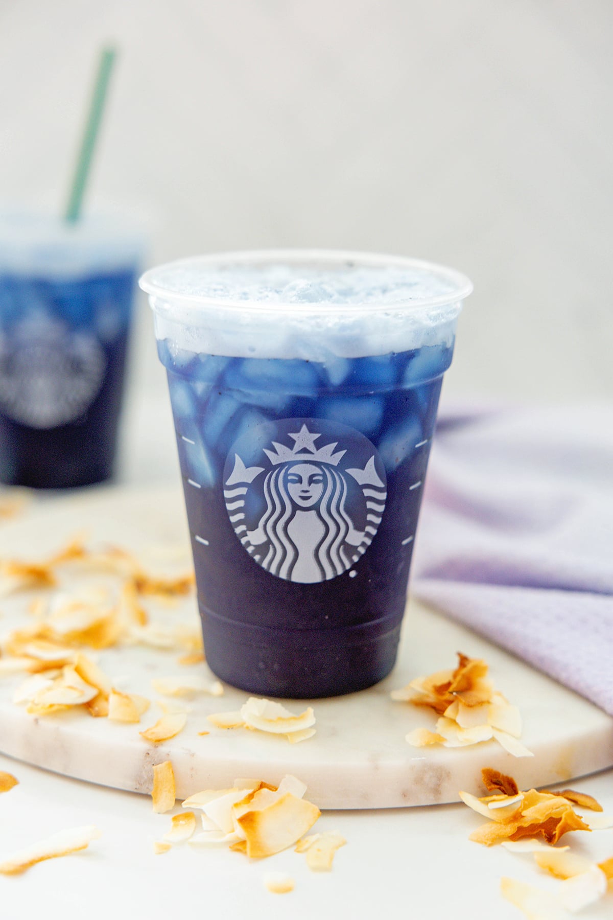 Two Blue Coconut Refreshers with toasted coconut all around.
