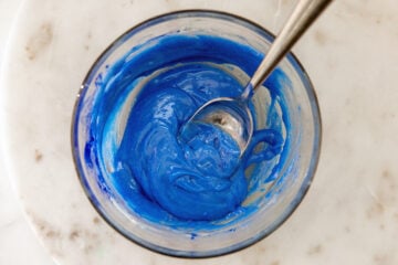 Sour blue drizzle in a bowl with a spoon.