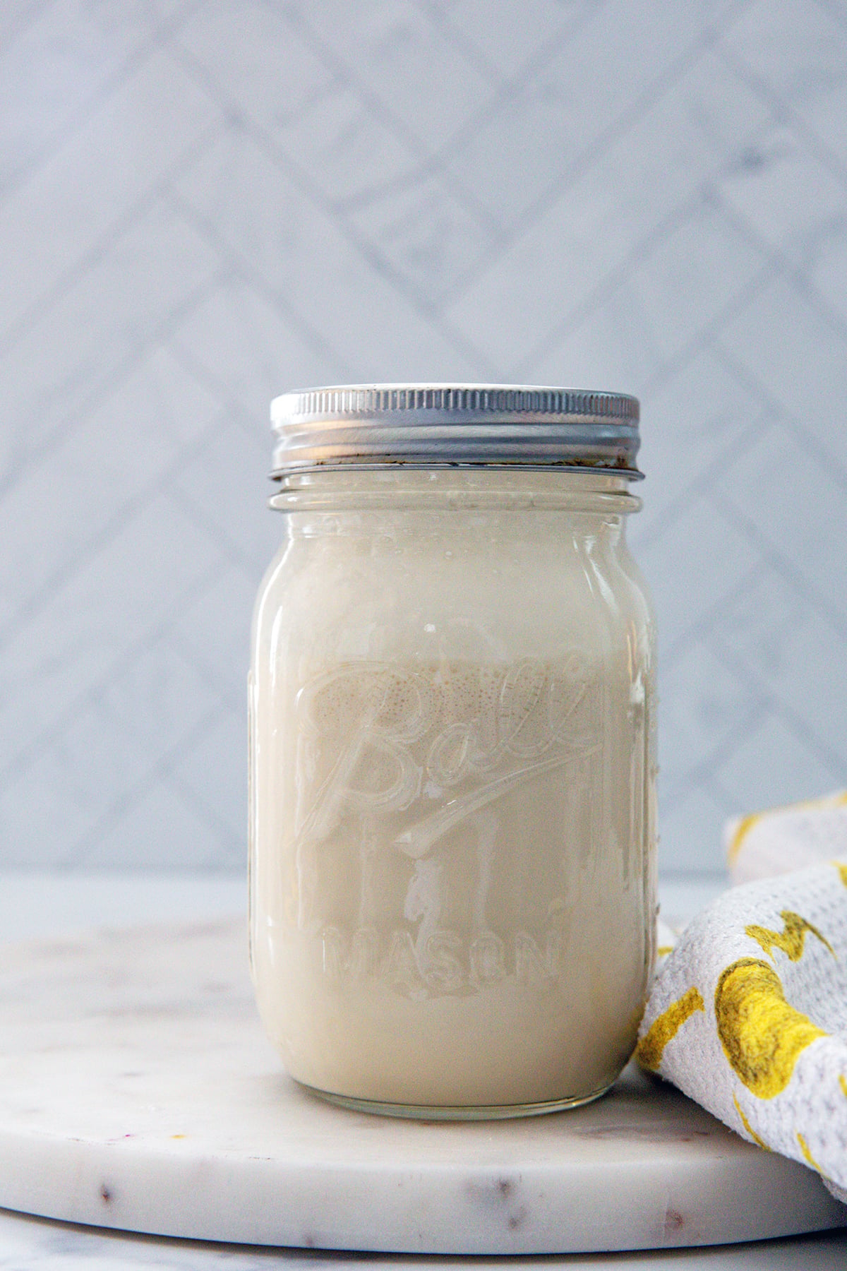 Head-on view of a mason jar of brown sugar sweet cream.