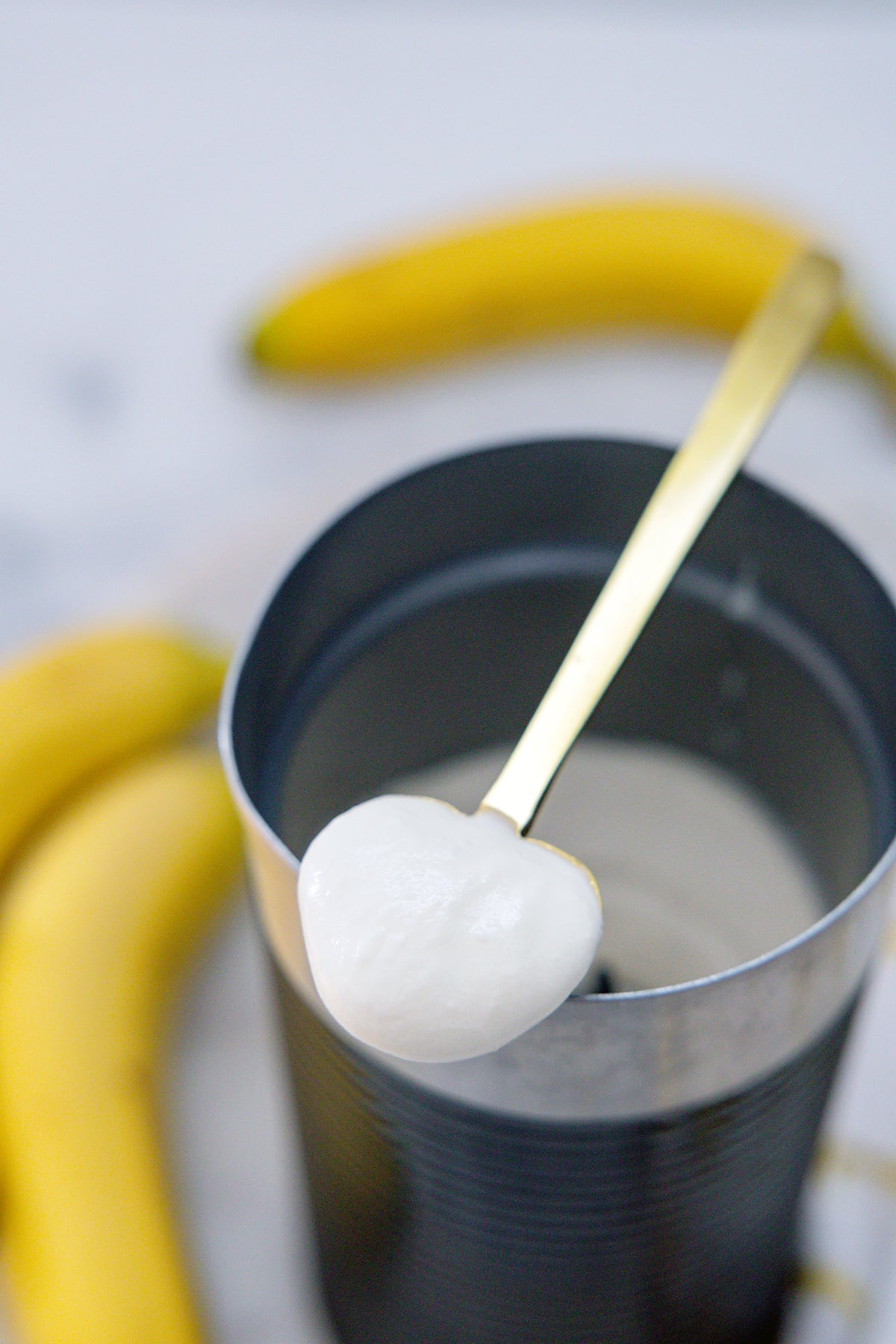 Brown sugar cold foam on a spoon.