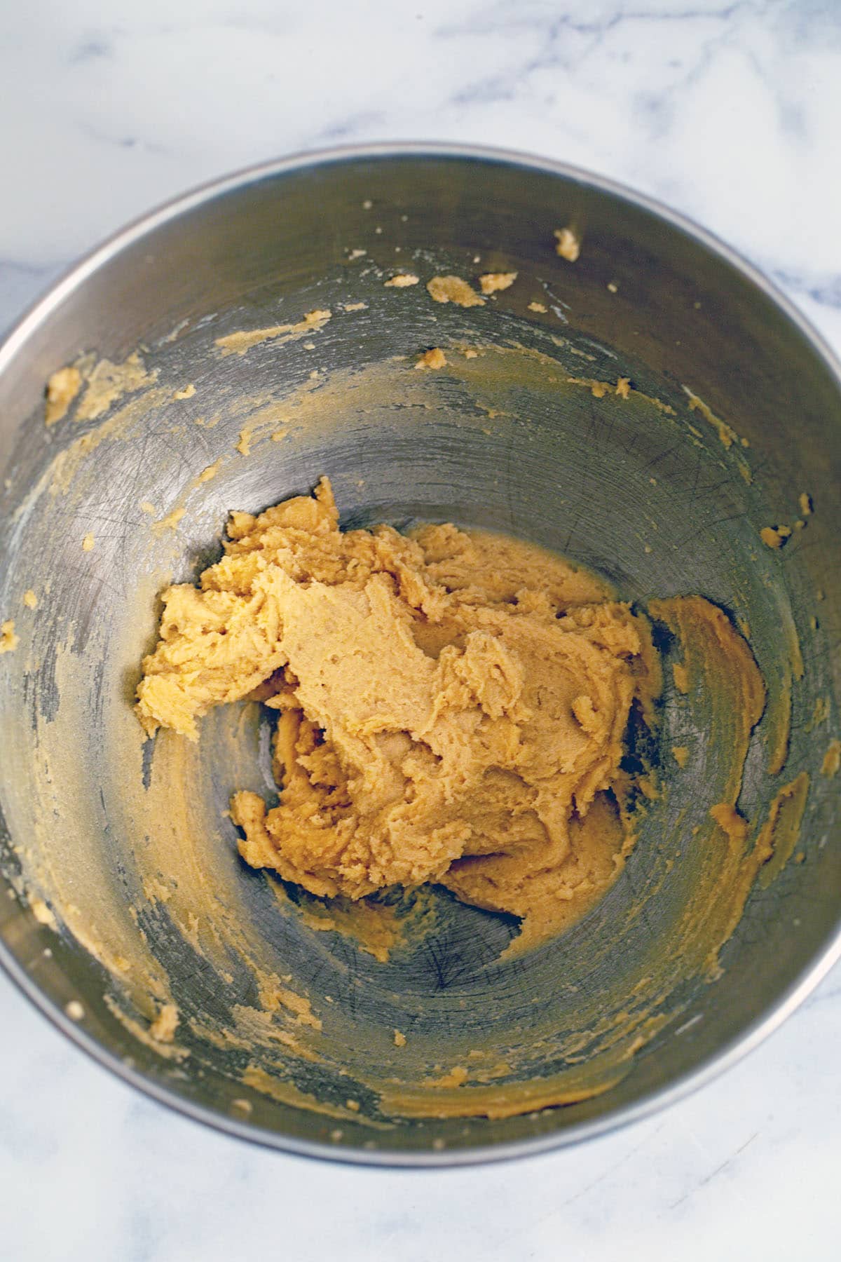 Butter and brown sugar creamed together in mixing bowl.