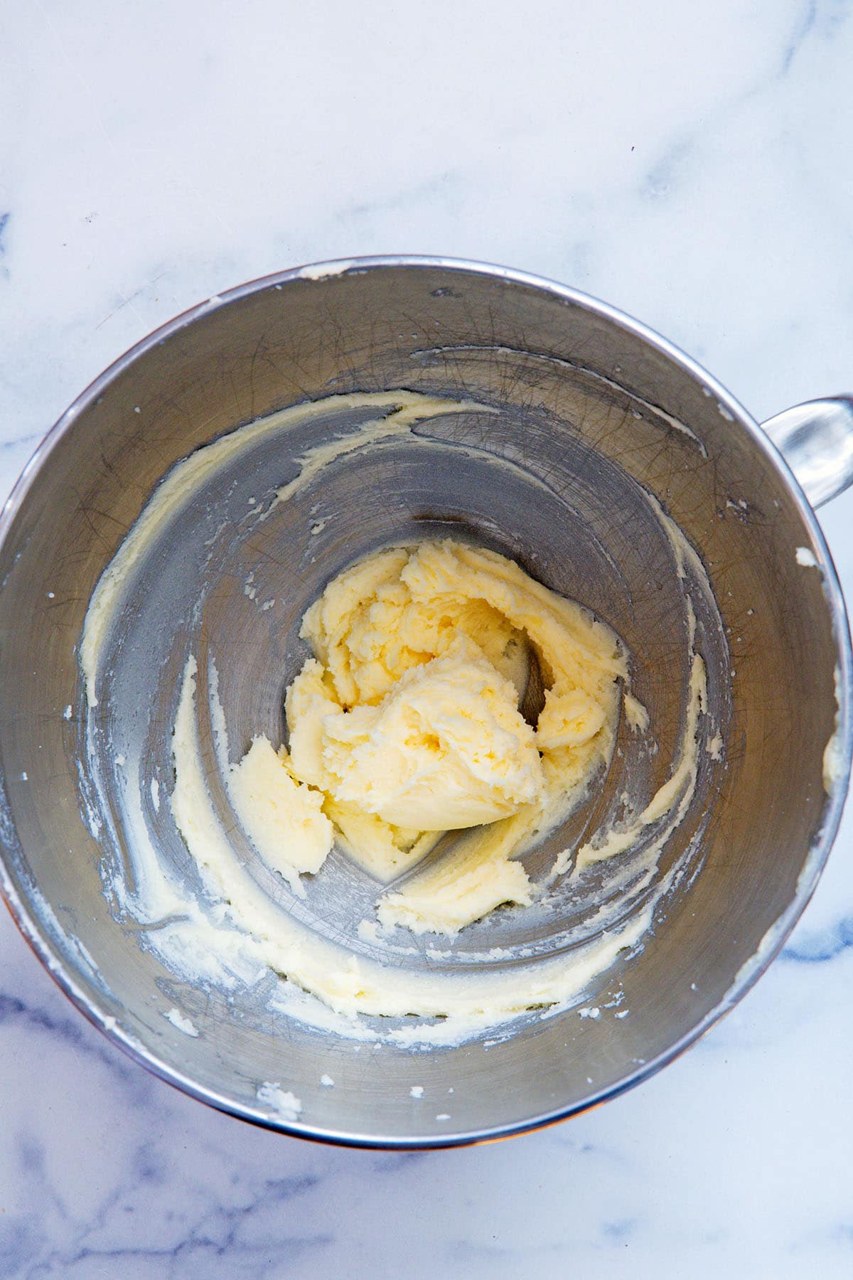 Butter and sugar beaten until soft and fluffy in mixing bowl.