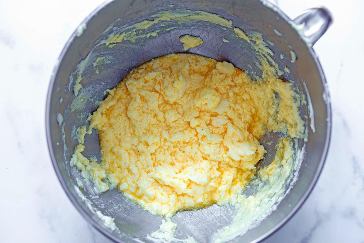Butter and sugar with eggs blended in in mixing bowl.