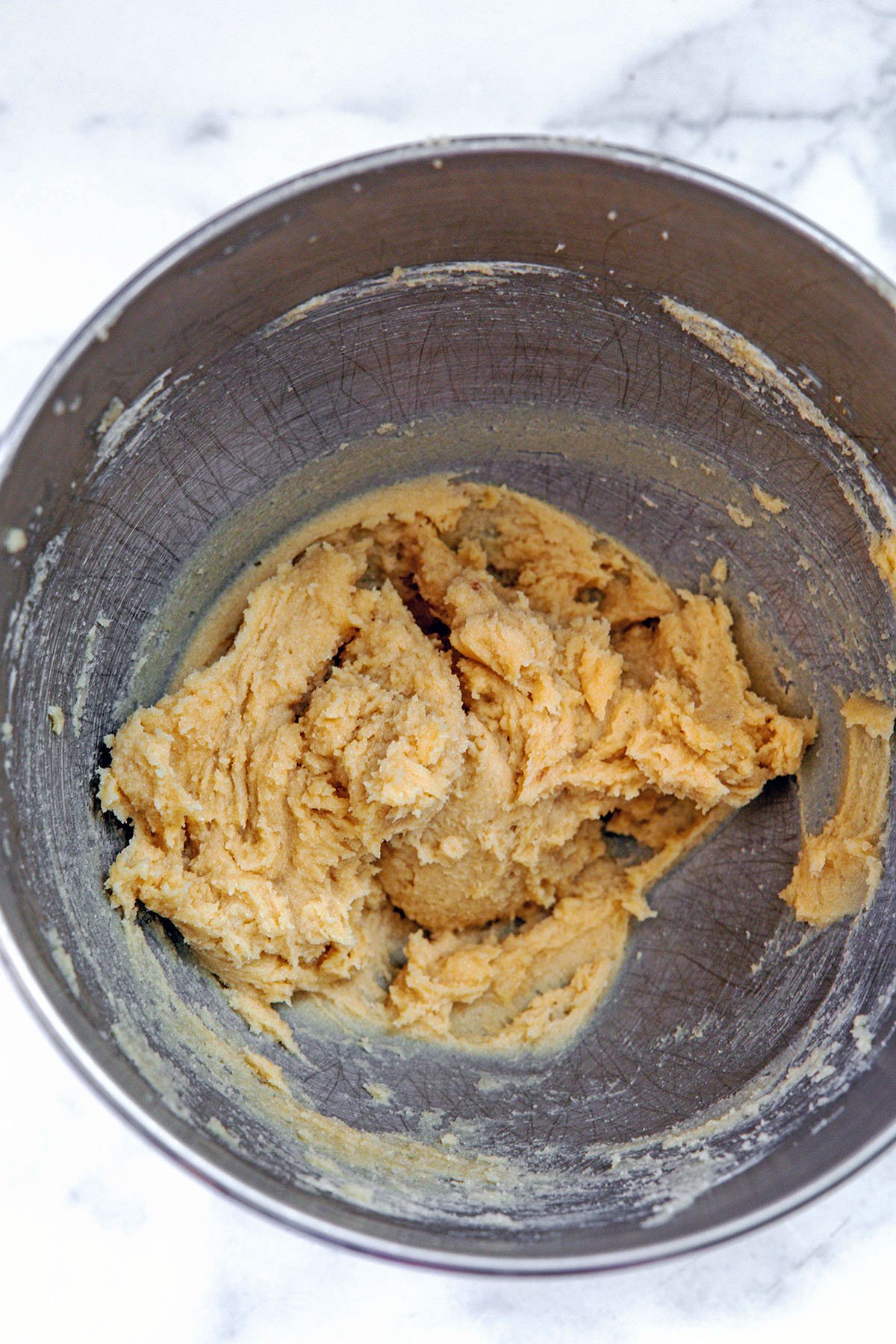 Butter and brown sugar creamed together in mixing bowl.