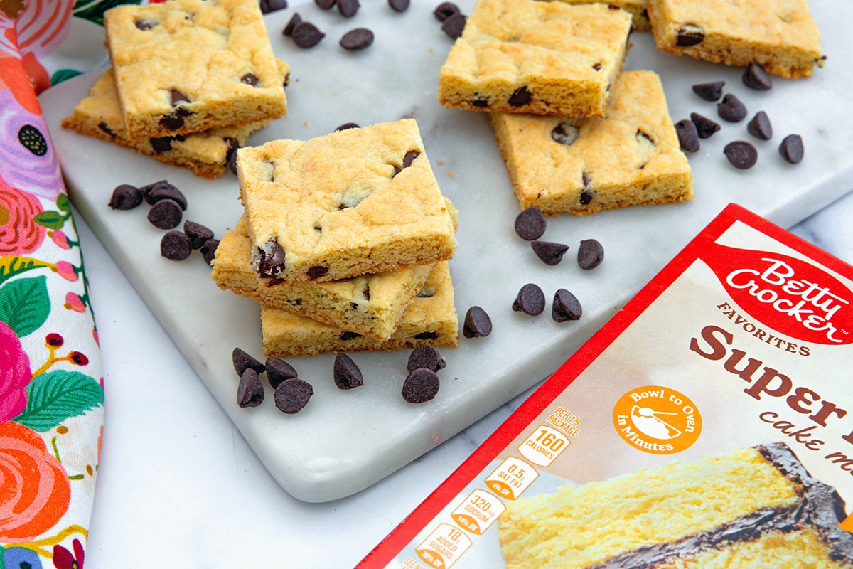 Landscape overhead view of chocolate chip cake mix cookie bats with bof of yellow cake mix.