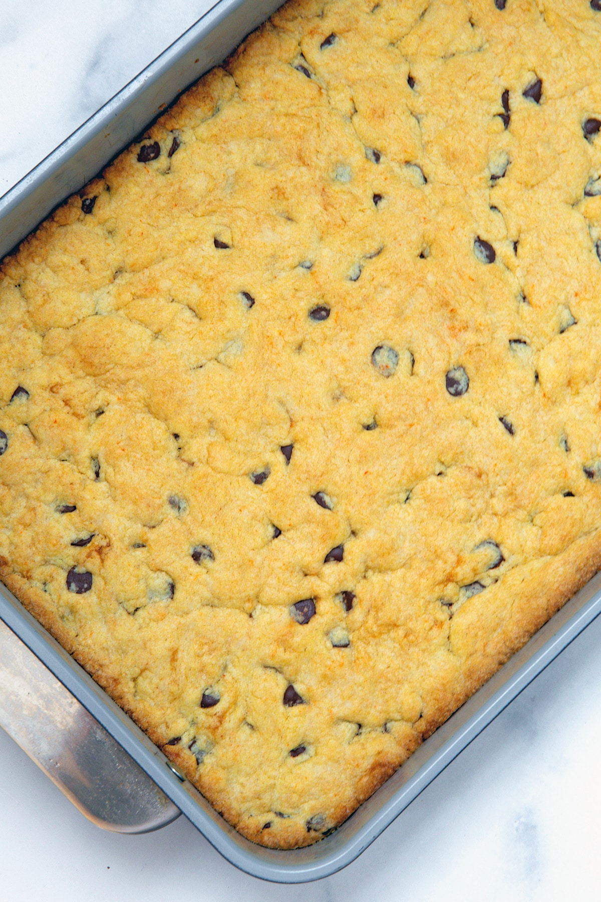 Cake mix cookie bars baked in cake pan.