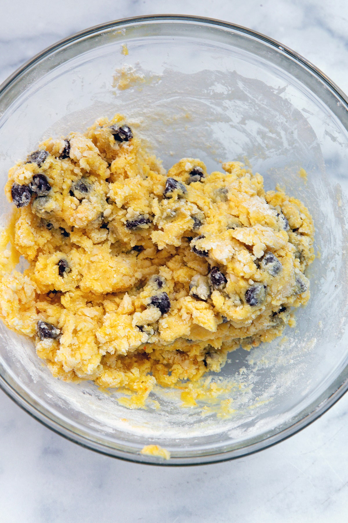 Chocolate chip cookie dough in mixing bowl.