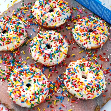 Closeup view of frosted cake mix donuts with rainbow sprinkles.