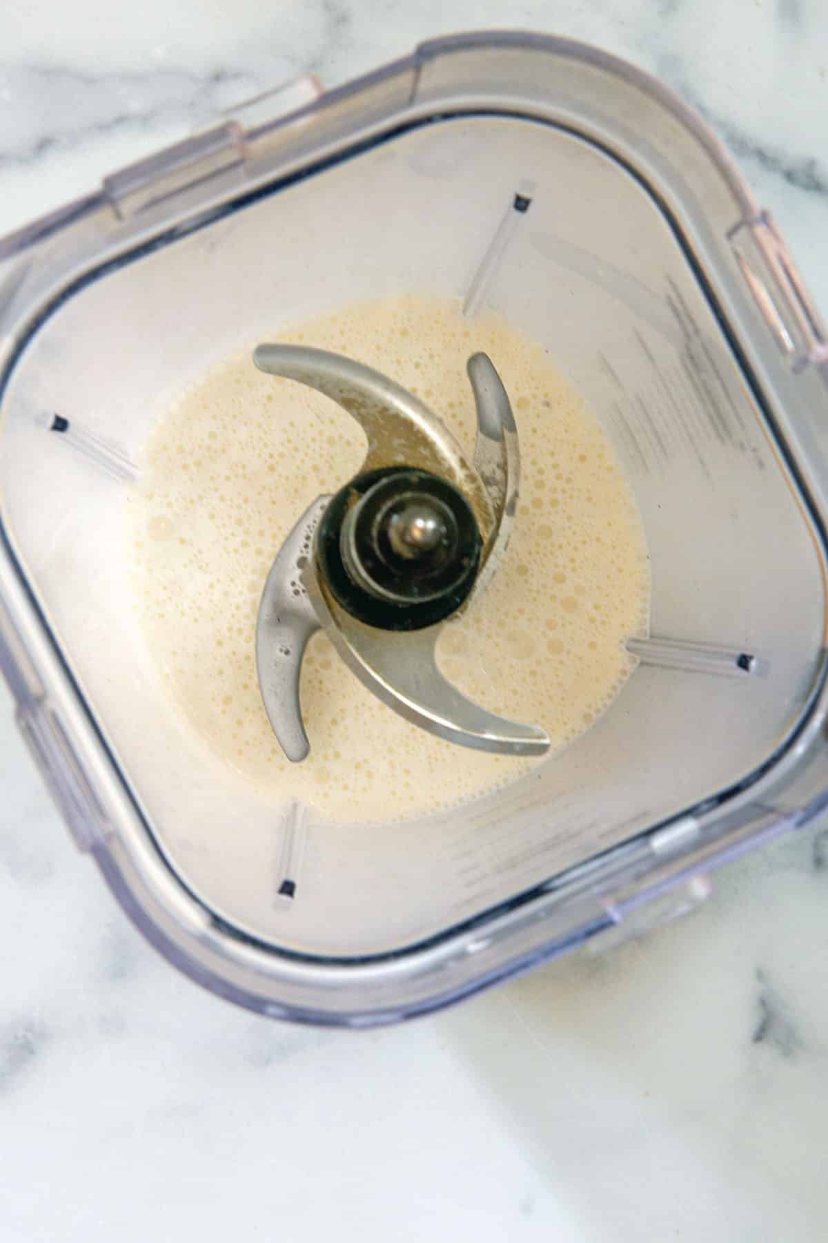 Overhead view of milkshake in blender.