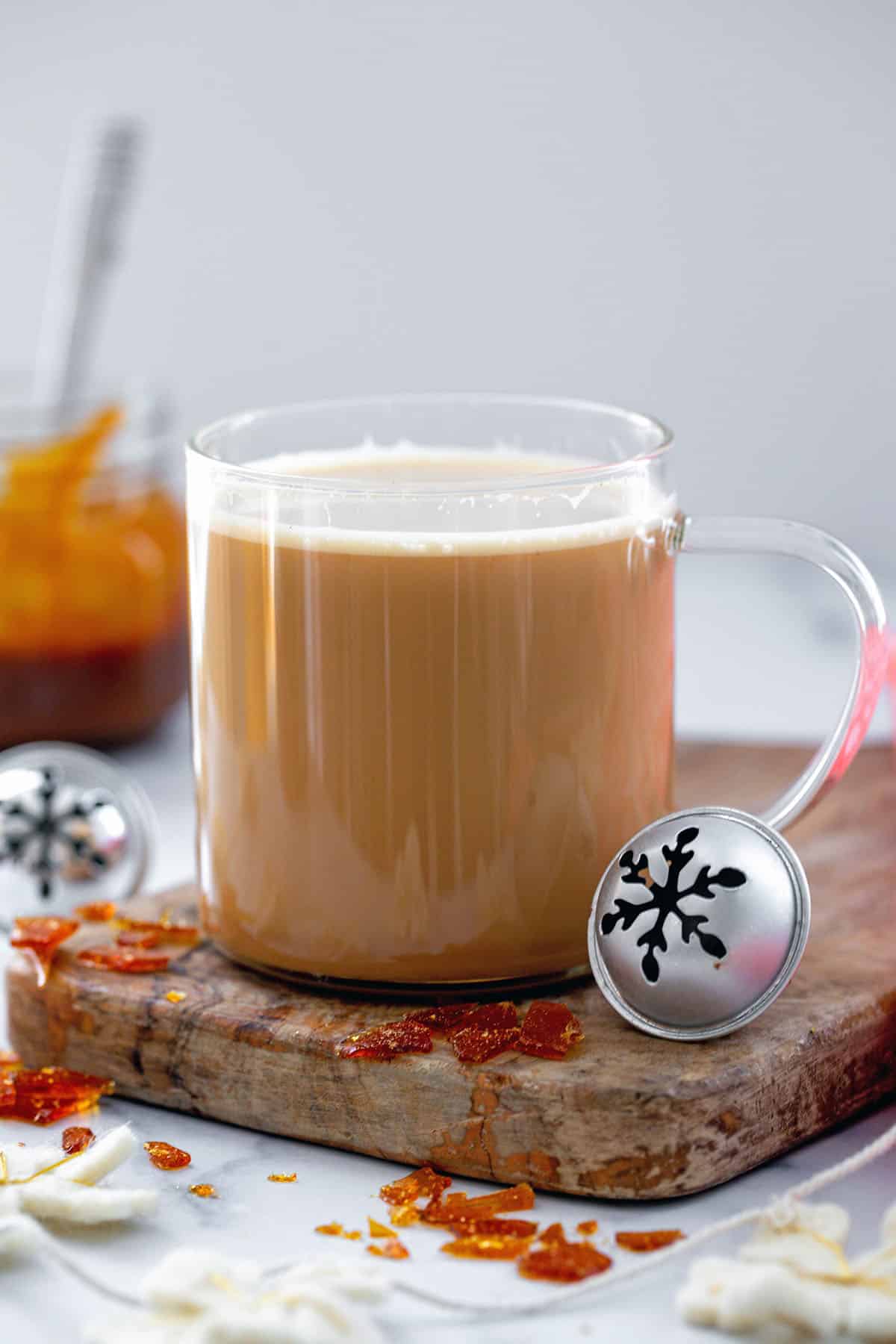 Caramel Brulée Latte without toppings in clear glass mug.