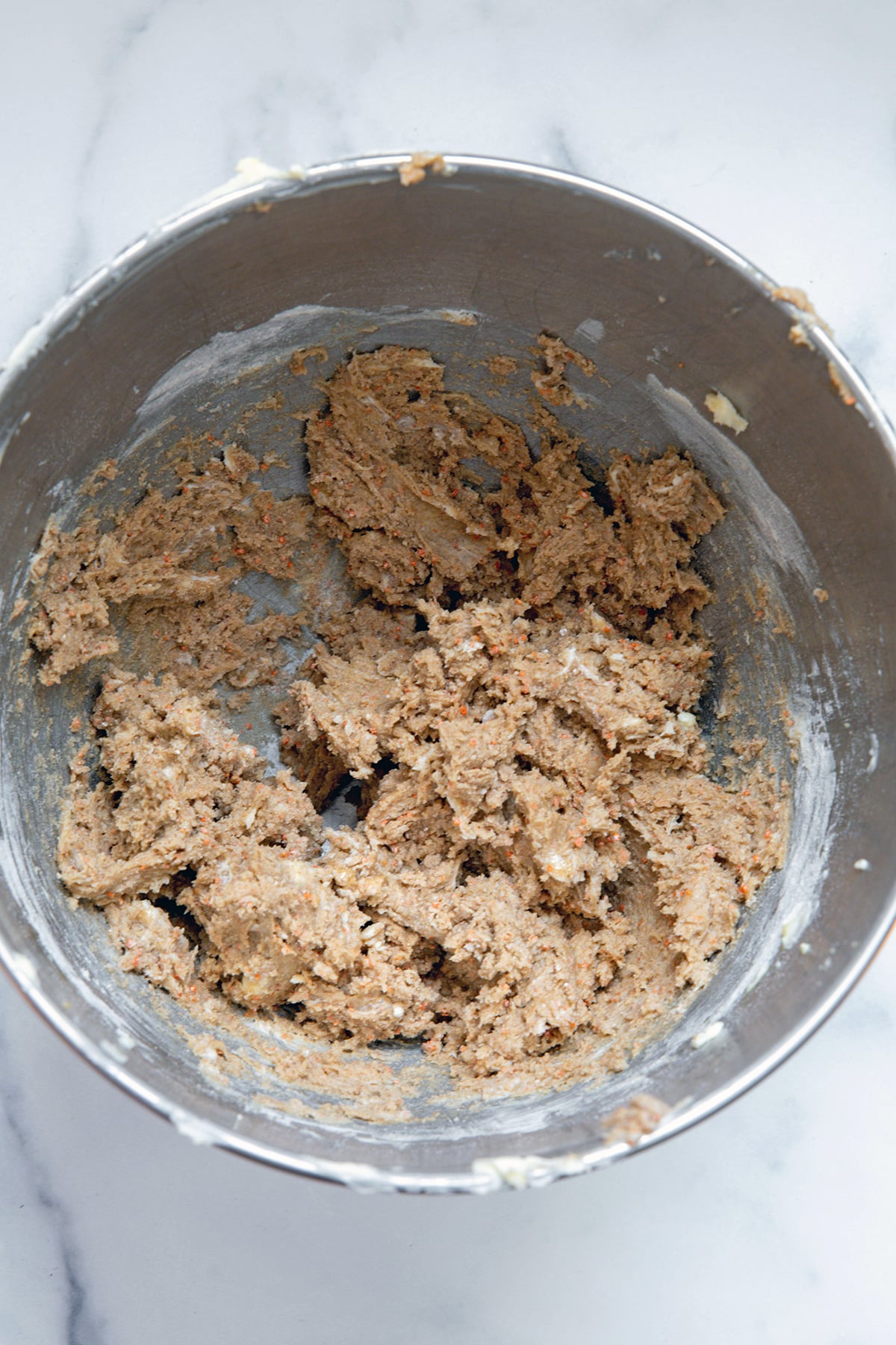 Carrot cake mix cookie batter in mixing bowl.