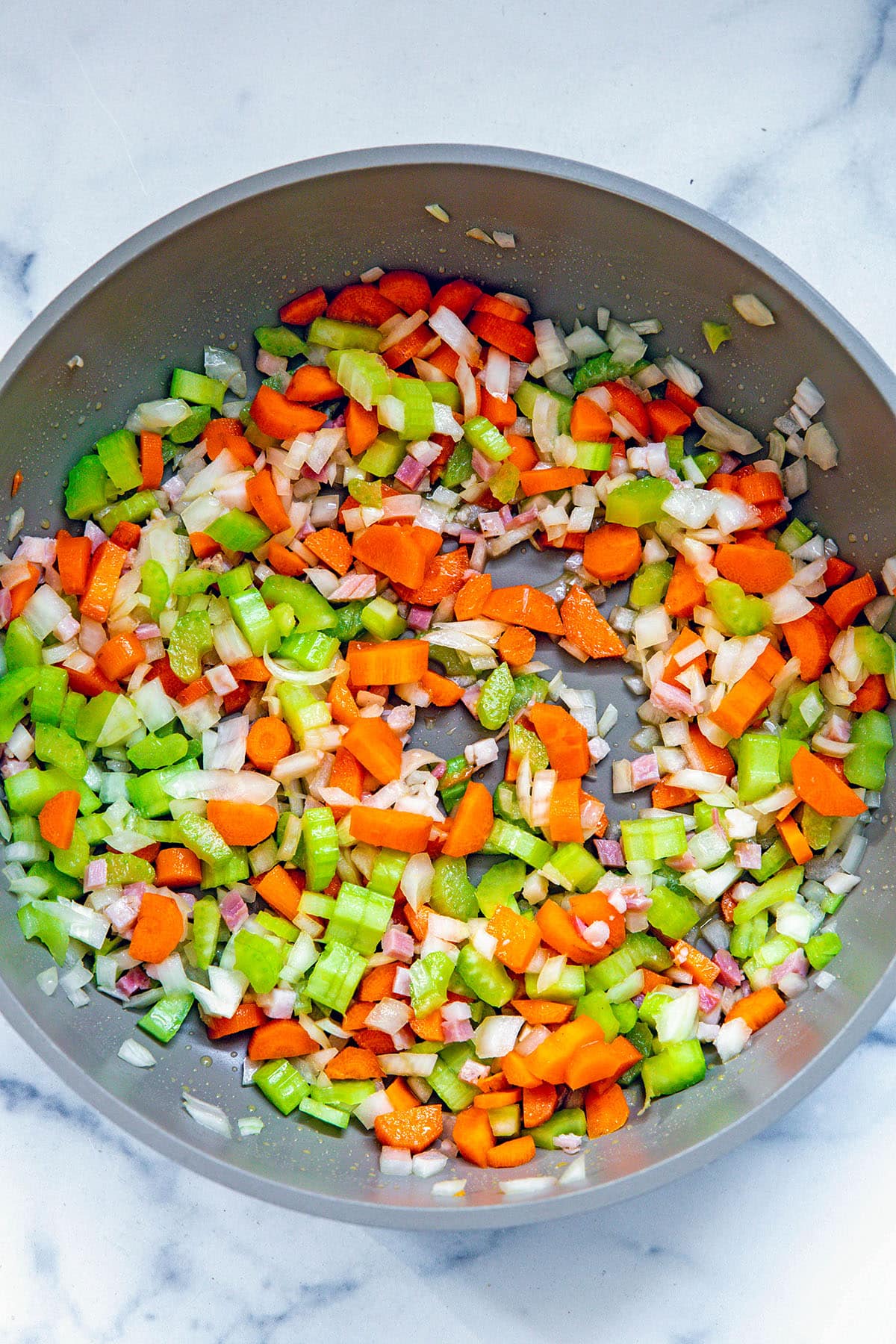 Diced celery, carrots, and onion in skillet.