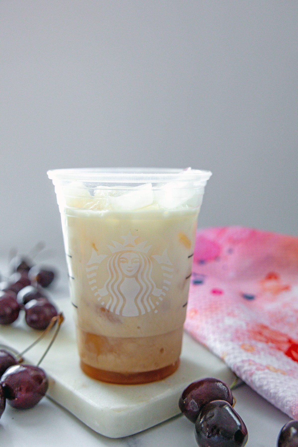 Chai concentrate and milk in Starbucks cup.