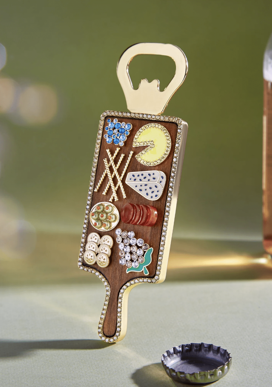 Gemstone encrusted charcuterie board bottle opener.