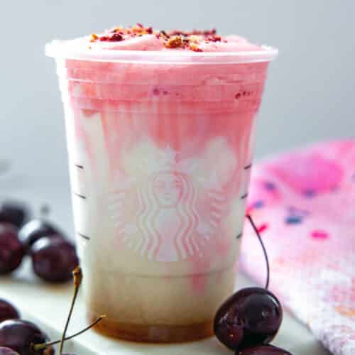 Close-up view of an Iced Cherry Chai Latte in a Starbucks cup.