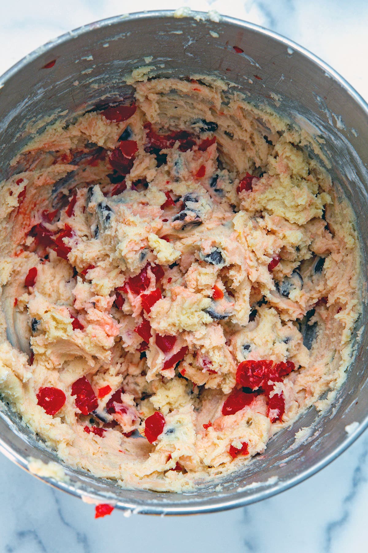Cherry chocolate chip cookie dough in mixing bowl.