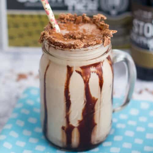 Closeup of a chocolate Cinnamon Toast Crunch stout milkshake with chocolate sauce drizzle.