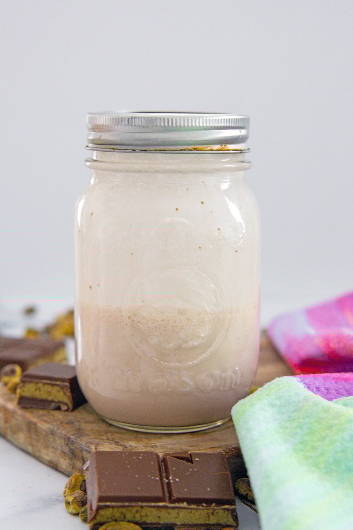 Head-on view of chocolate cold cream in a mason jar.