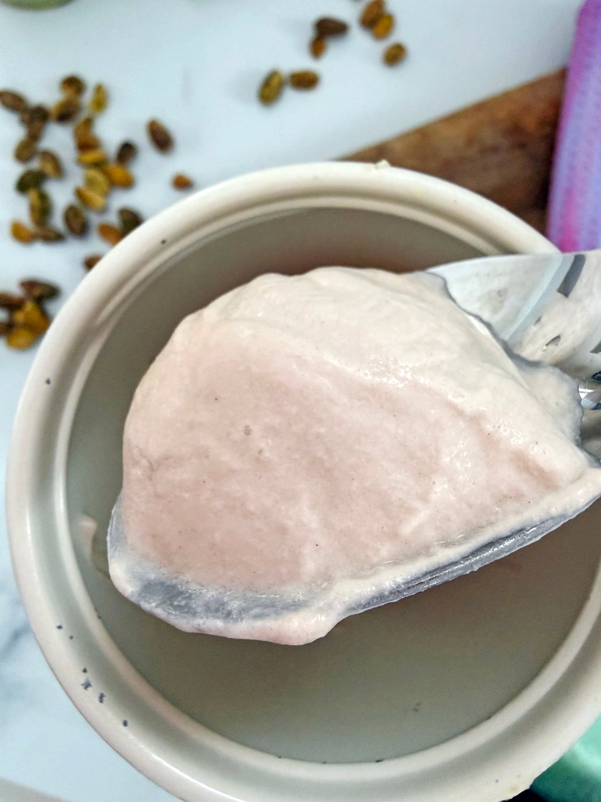 Chocolate cold foam on a  spoon.