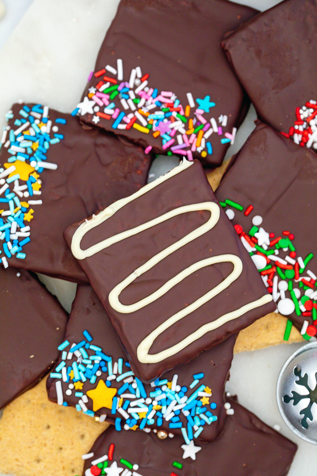 Chocolate covered graham crackers with sprinkles.