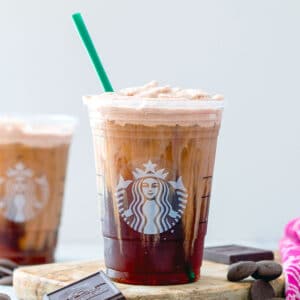 Close-up head-on view of a chocolate cream cold brew in a Starbucks cup.