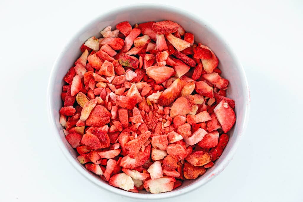 Chopped freeze-dried strawberries in a bowl.