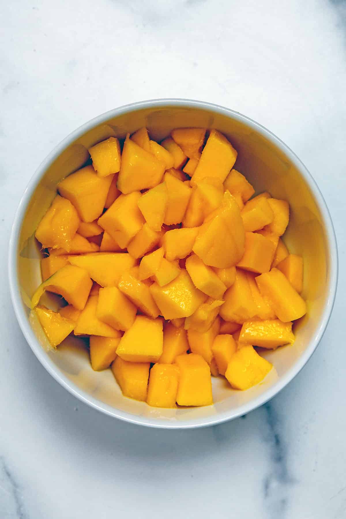 Chopped mango in a bowl.