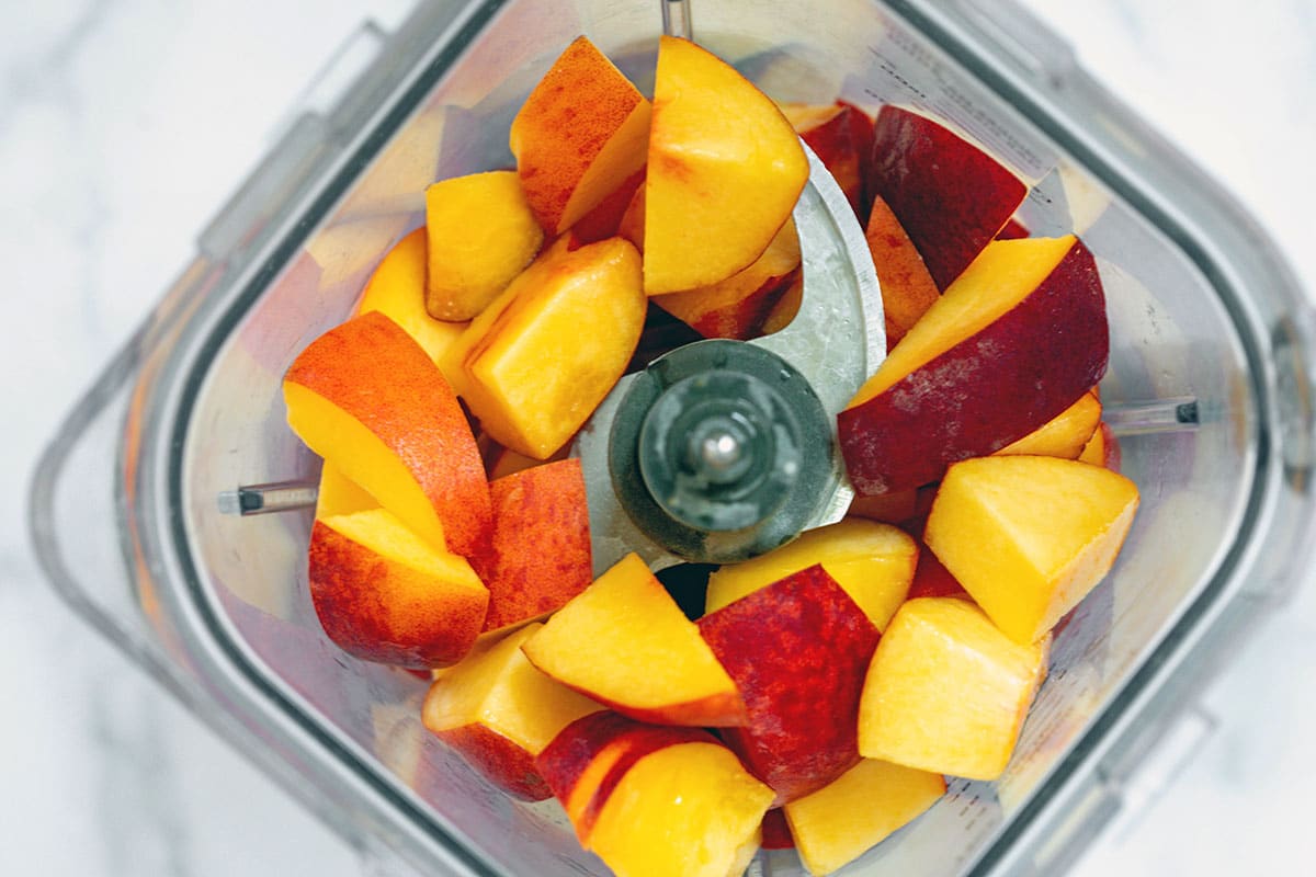 Sliced peaches in blender.