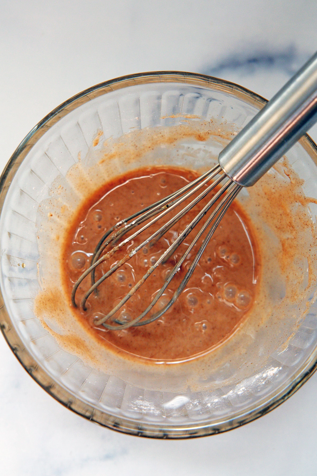 Maple cinnamon icing drizzle in bowl.