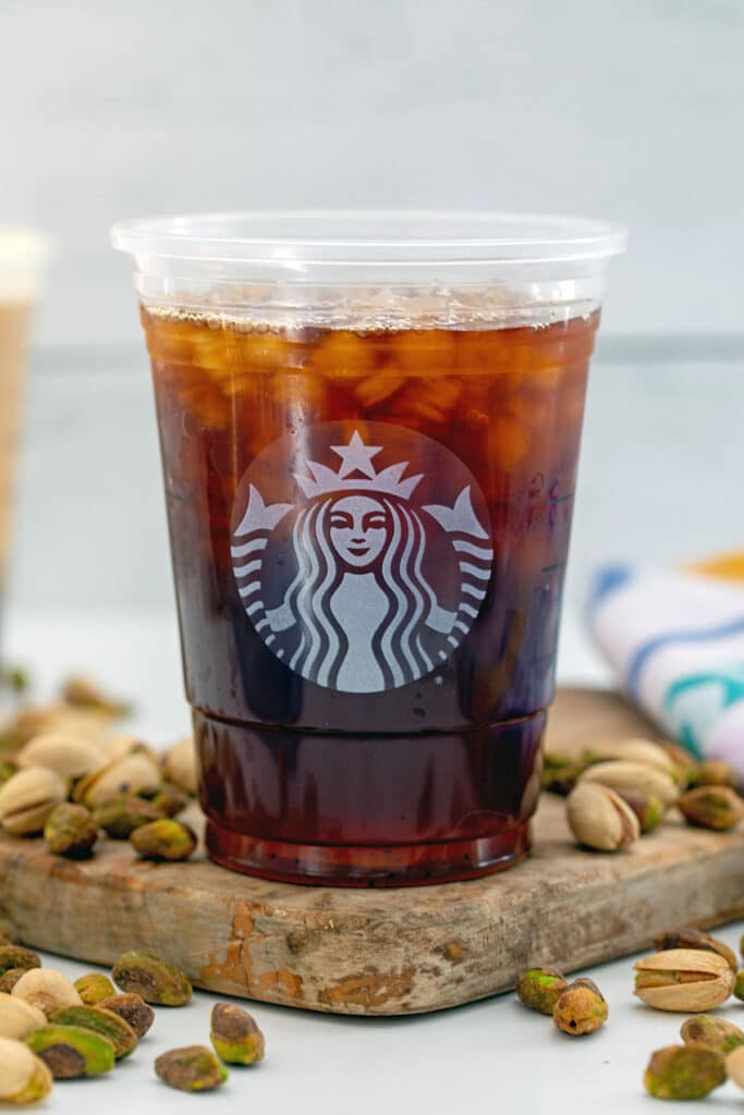 Cold brew with vanilla syrup in Starbucks cup.