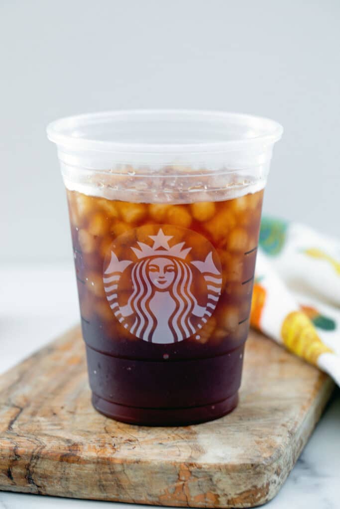 Cold brew with ice in a Starbucks cup.