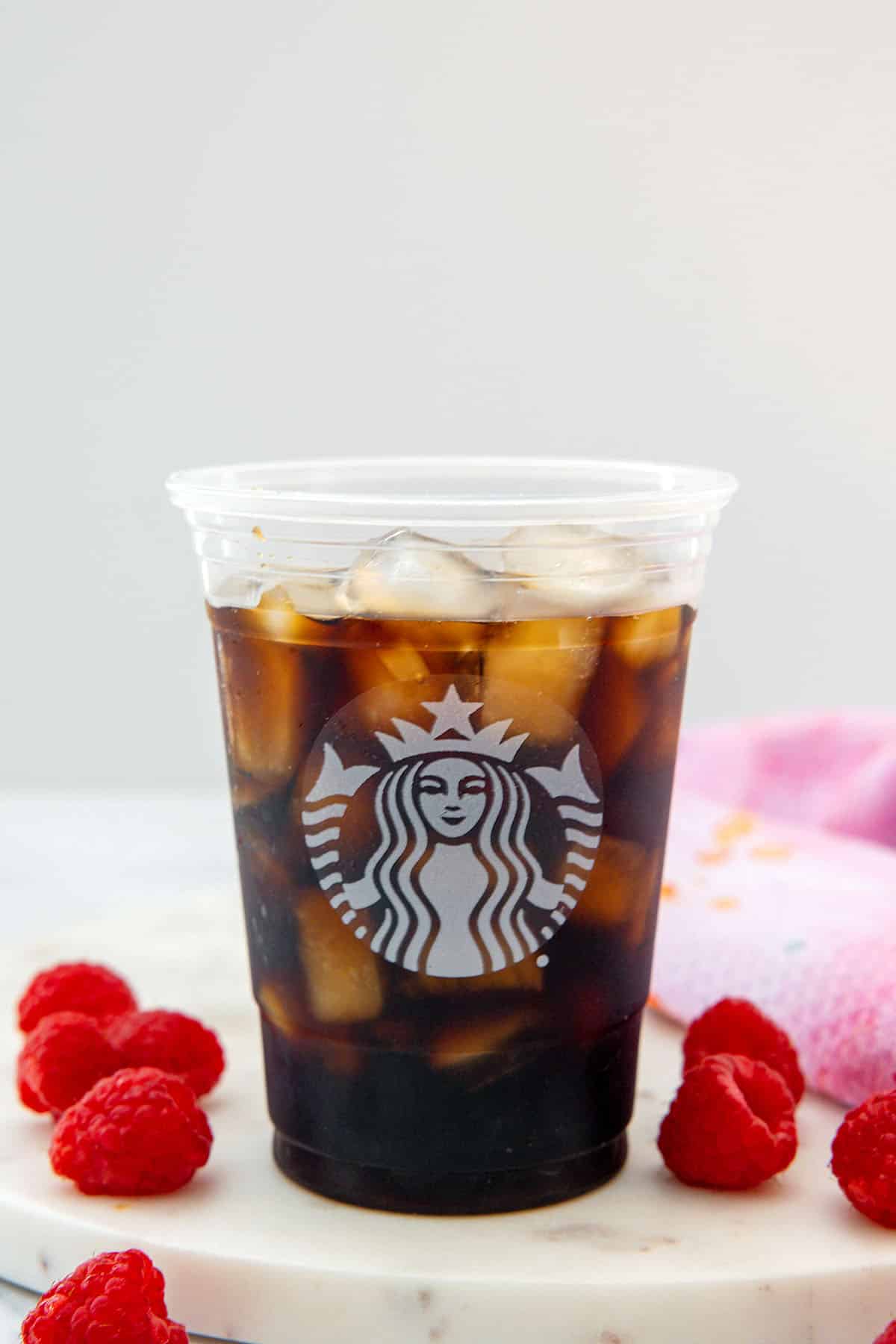 Starbucks cup filled with ice and espresso.