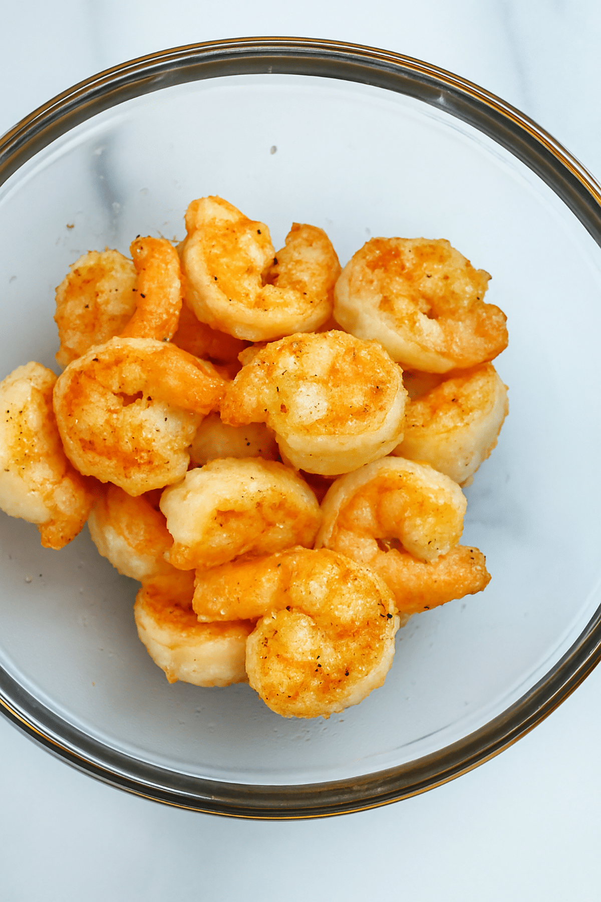 Cooked shrimp in bowl.