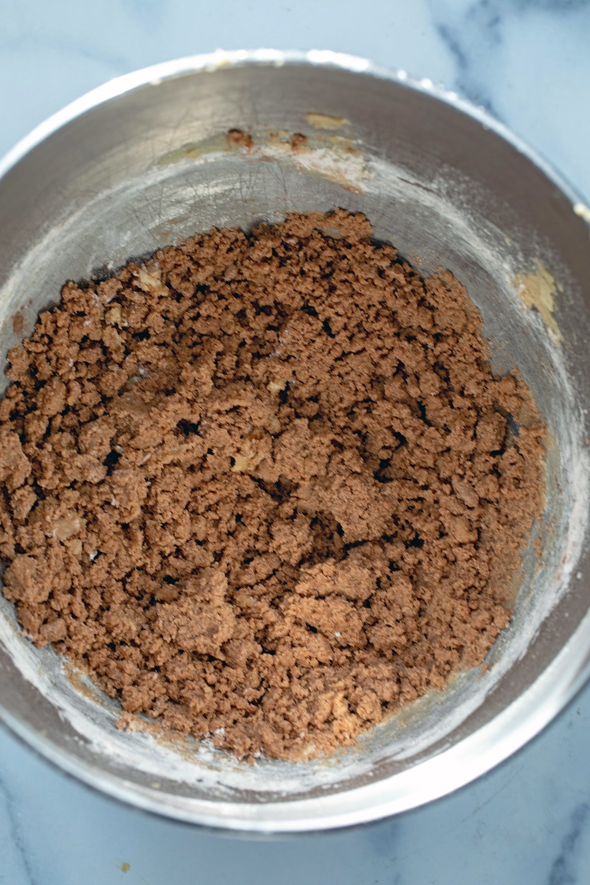 Butter, brown sugar, and flour in mixing bowl.